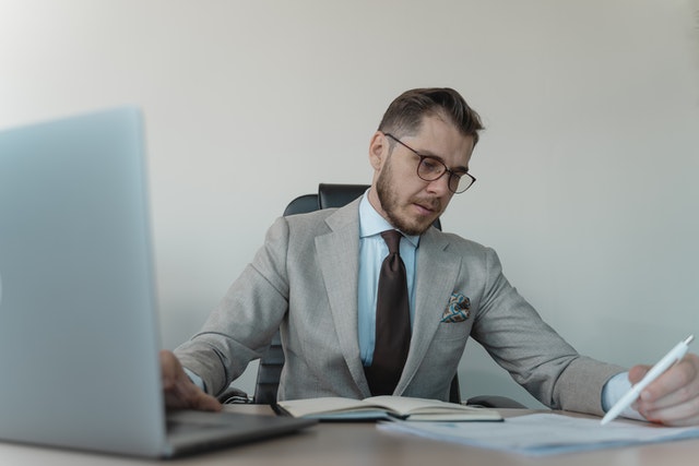 man looking at papers