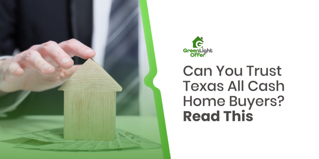 Close-up of a person&rsquo;s hand over a wooden house model with cash beneath it, symbolizing real estate deals and trust in Texas all cash home buyers.