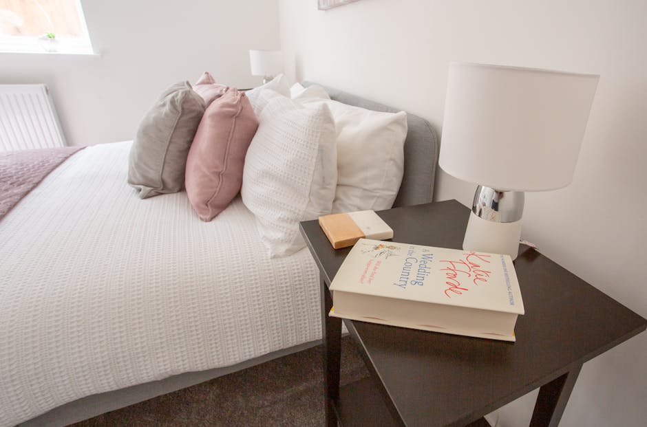 Neutral staged bedroom with white bedding, soft pillows, and tidy nightstand - how can i get my house ready to sell fast